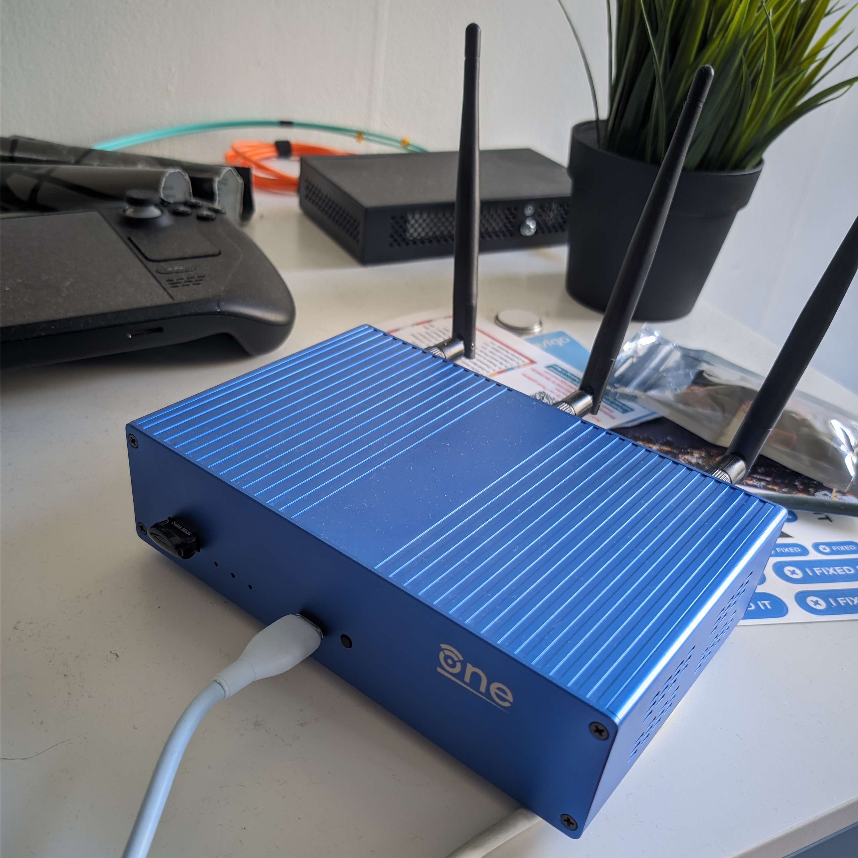 A picture of the OpenWRT One from the front